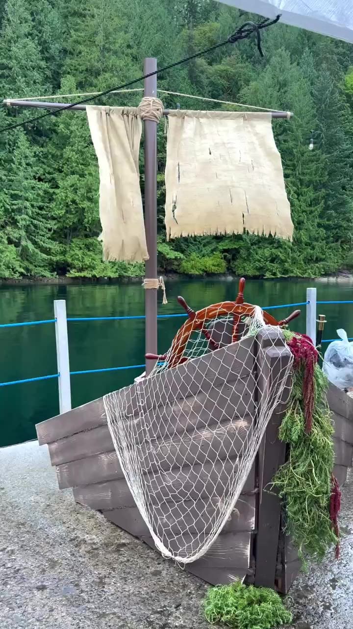 BC Day long weekend raft-up — a dozen yachts stern-tied in the fjord, dinner set up on the float